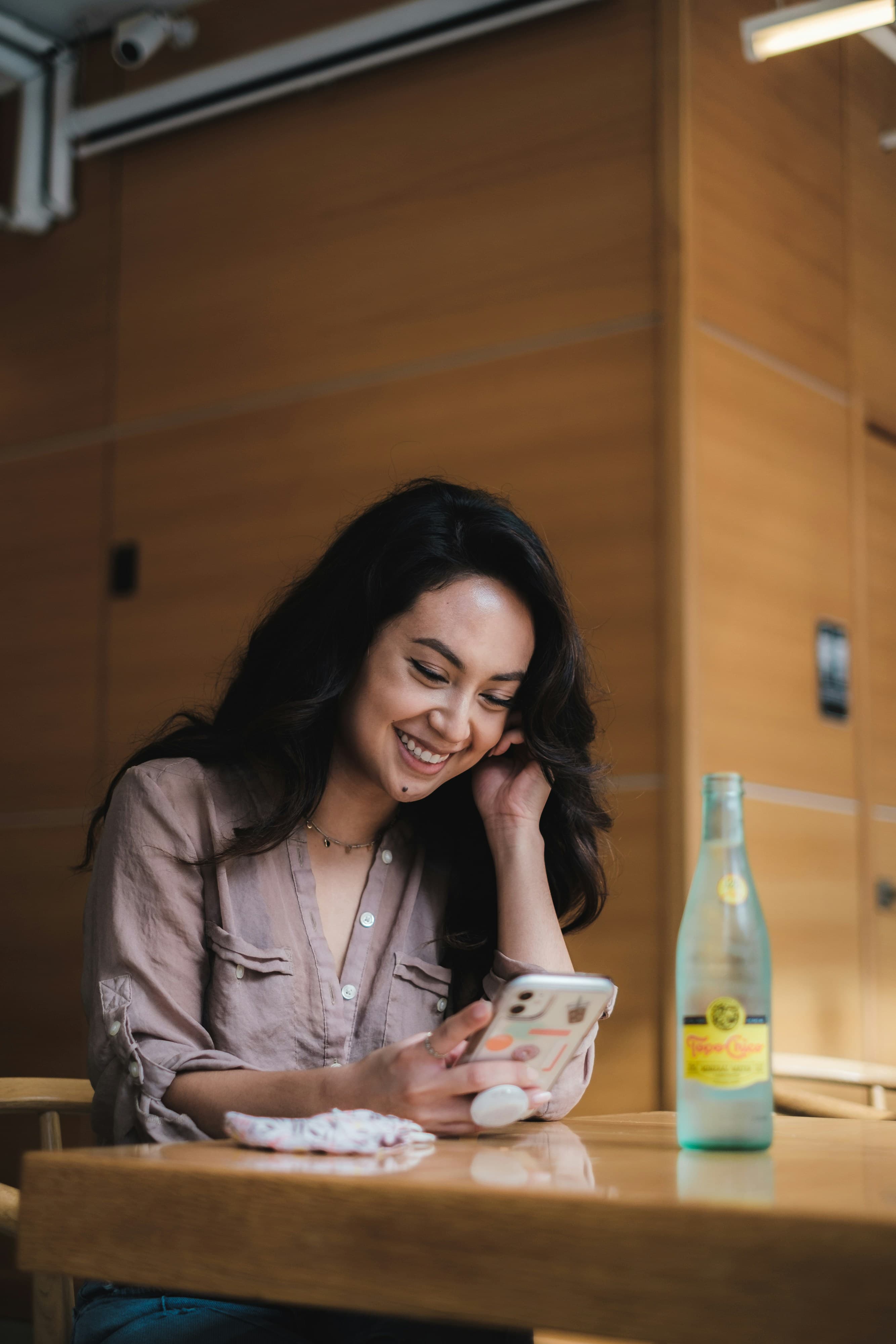 Woman smiling in a warmly lit café